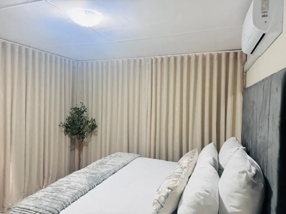 Bedroom with grey wave curtains
