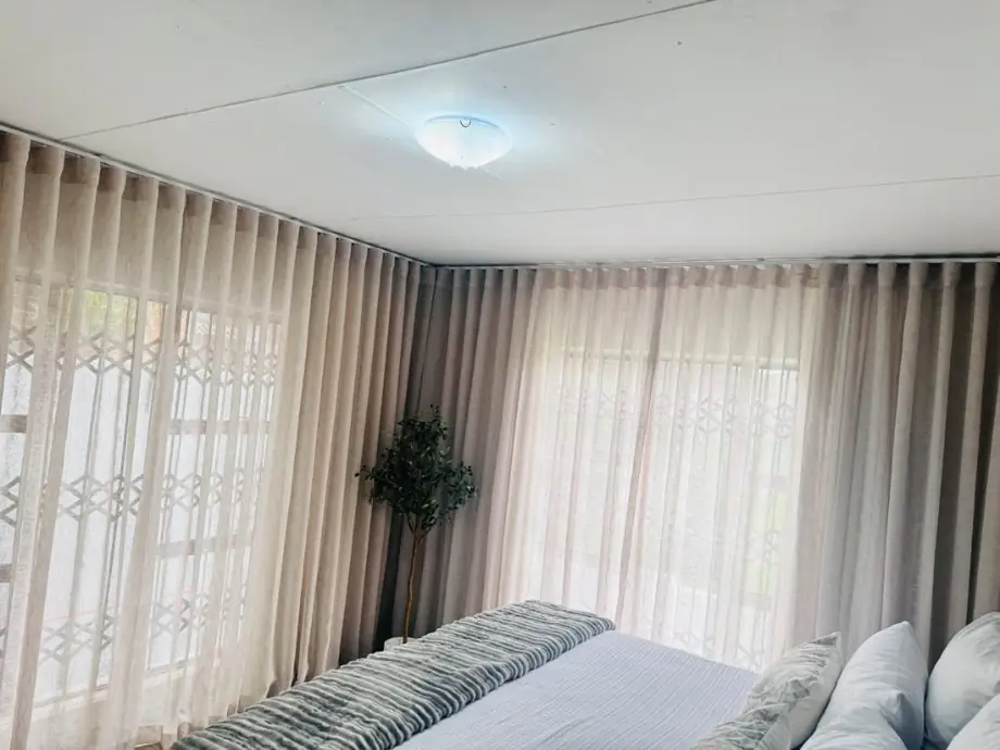 Living room with layered sheers and curtains