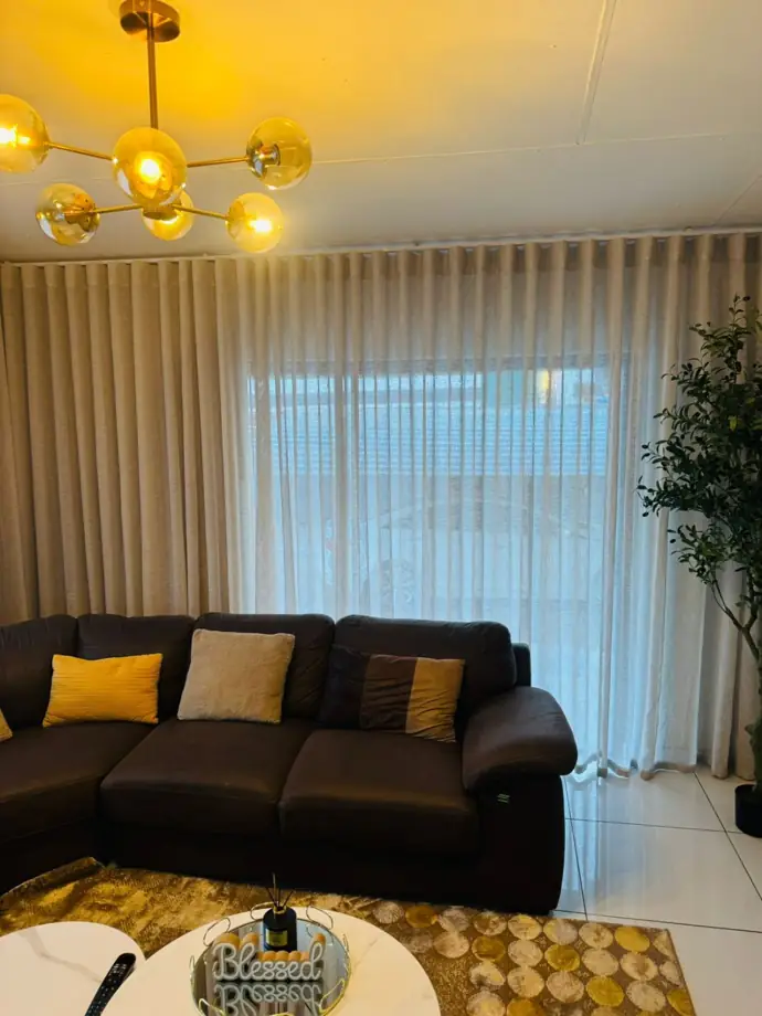 Warm lounge with custom wave curtains in Thohoyandou